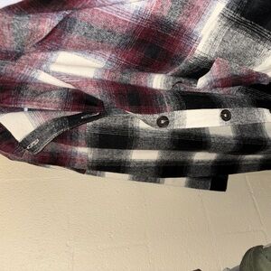 Plaid Shacket from a local boutique it is a size 3x never worn